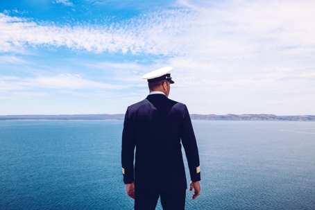 navy officer overlooking ocean